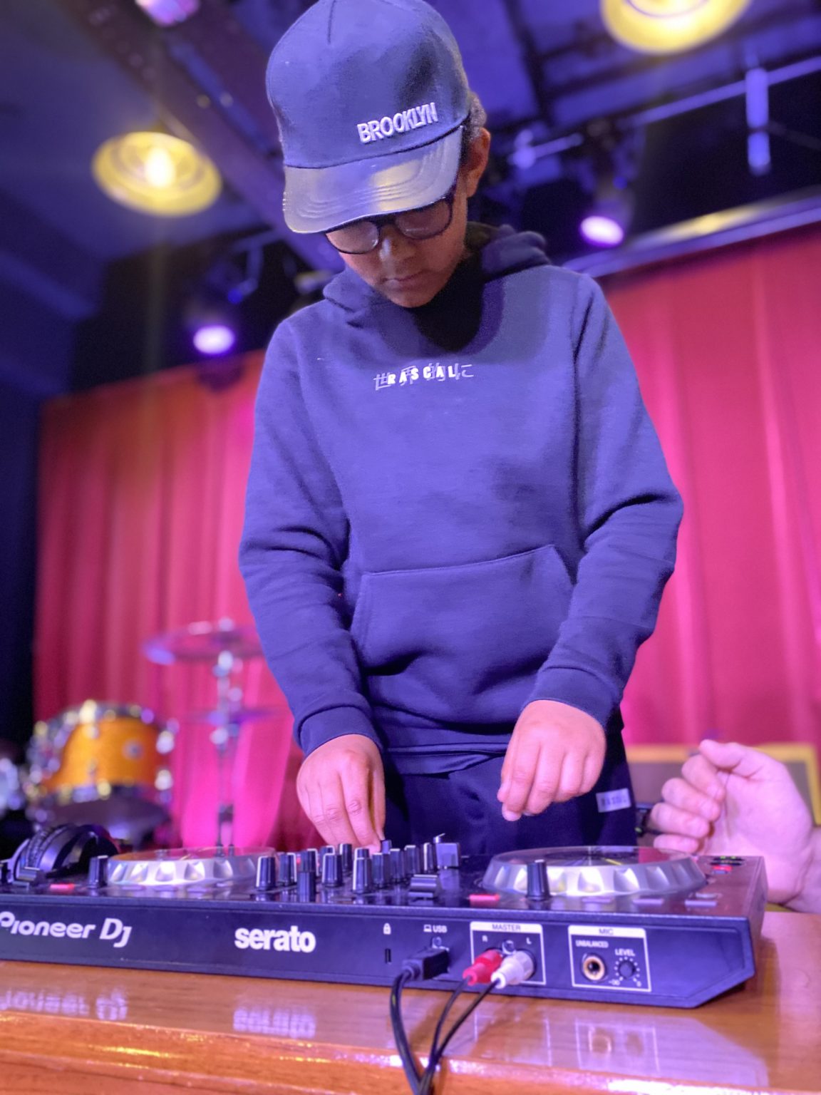 Young person DJing on stage