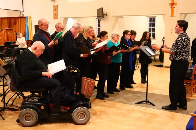 Adult choir performing in a church