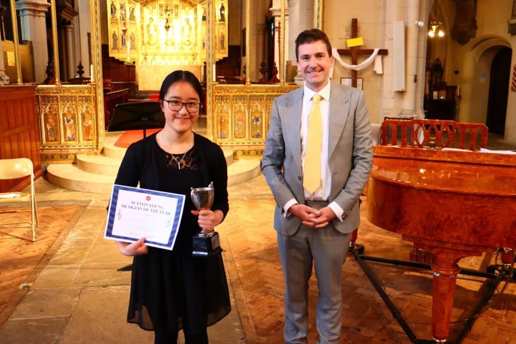 Young person receiving an award from the adjudicator