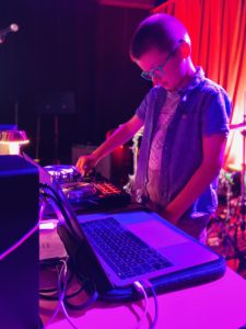 A person playing music on a turntable.