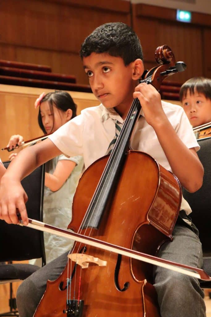 Image of a child playing a cello
