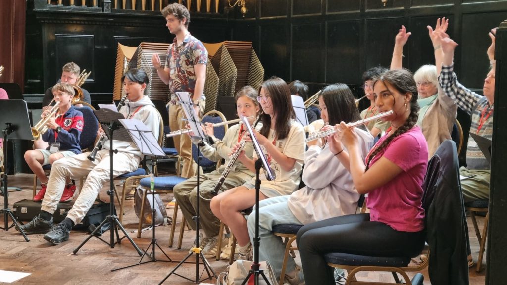 Group of children playing wind and brass instruments