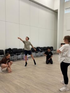 Male and female dancers creating poses