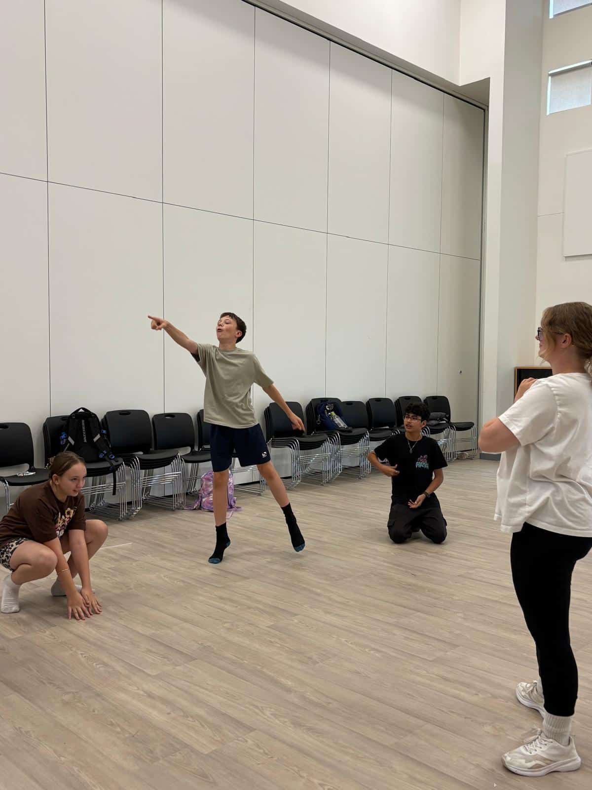 Male and female dancers creating poses